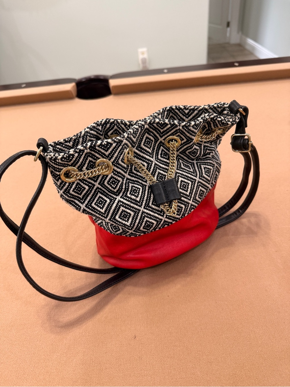 Black & White Patterned Drawstring Bucket Bag with Red Base